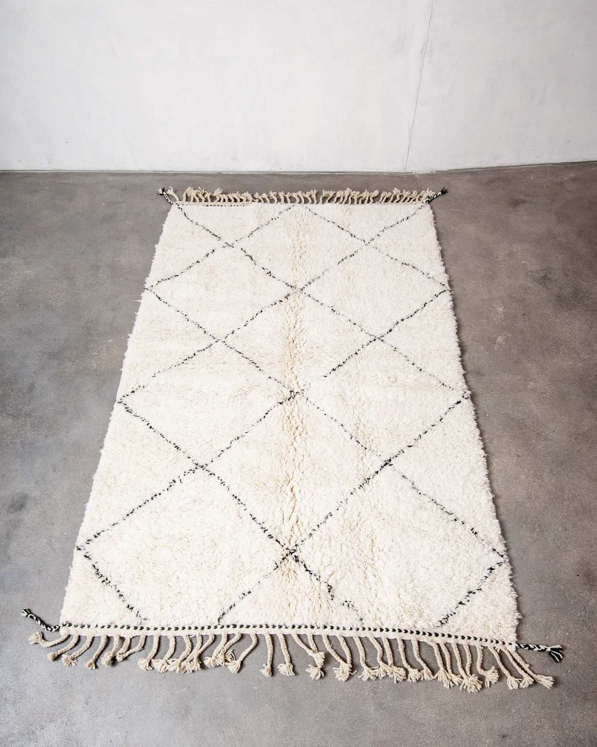 Modern, designer, handcrafted Berber rug from Morocco. Beniourain carpet with minimalist design, natural wool pile and a fluffy texture.